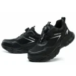 Compact black safety trainers with steel toe, slip-resistant sole, and breathable mesh lining. Zenith 907B