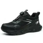 Compact black safety trainers with steel toe, slip-resistant sole, and breathable mesh lining. Zenith 907B