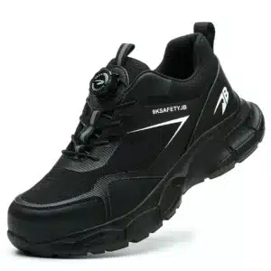 Compact black safety trainers with steel toe, slip-resistant sole, and breathable mesh lining. Zenith 907B